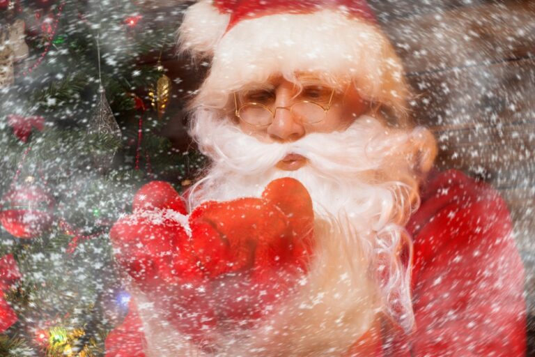 santa blowing snow towards reader representing holiday checklist for well-being